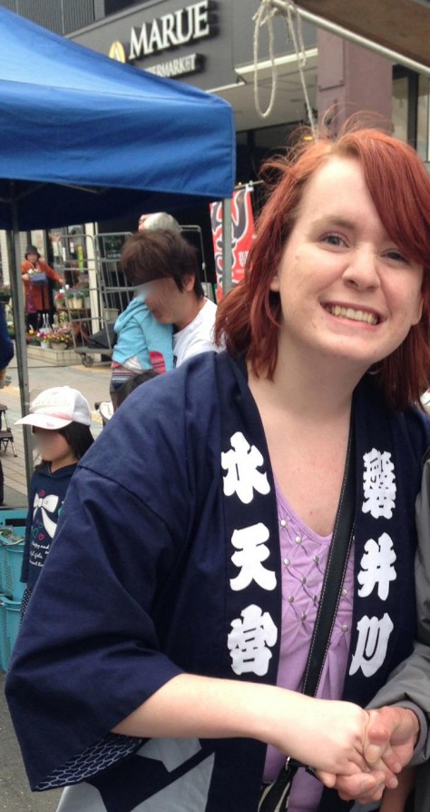 Jenny Parker in Japan. She had to crop out her friend because of Japanese privacy laws. They put a robe on her and conscripted her into the parade. Jenny, my song.