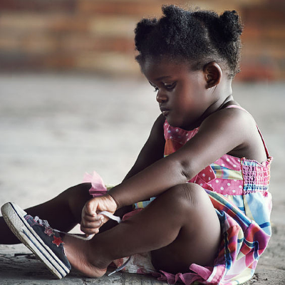 toddler putting on shoes