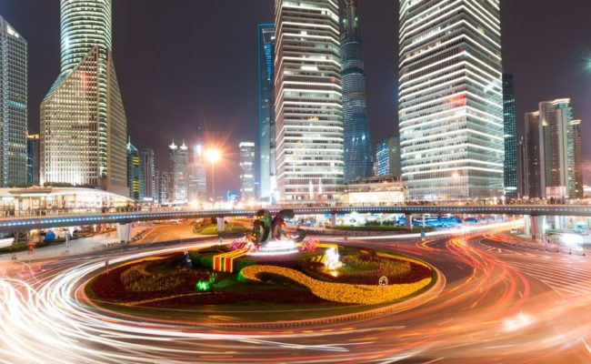 34638349 - shanghai downtown at night with roundabout light trails